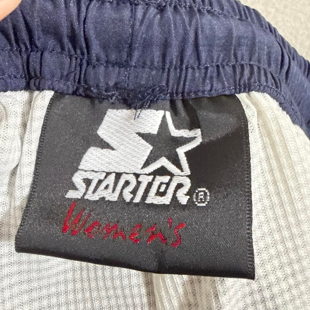 Starter blue track pants with blue stripes down the sides wide leg zip flare